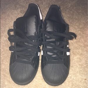 Pair of black adidas low-top sneakers